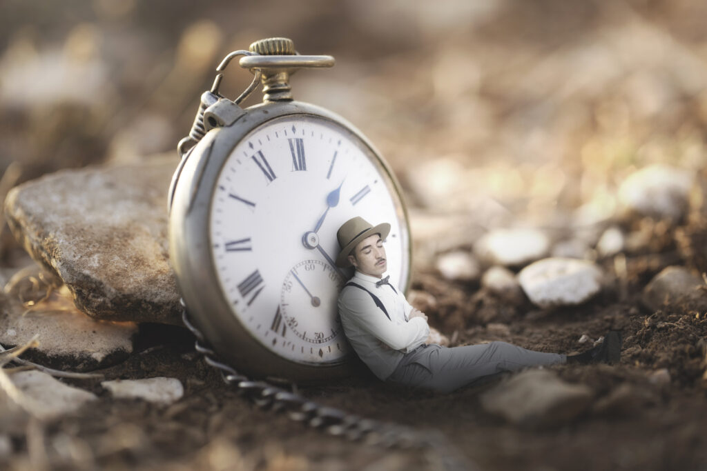 man falls asleep leaning on a large clock, abstract concept